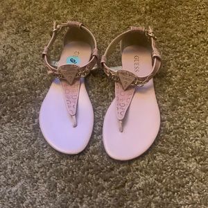 Pink size 6 Guess sandal with gold trim.